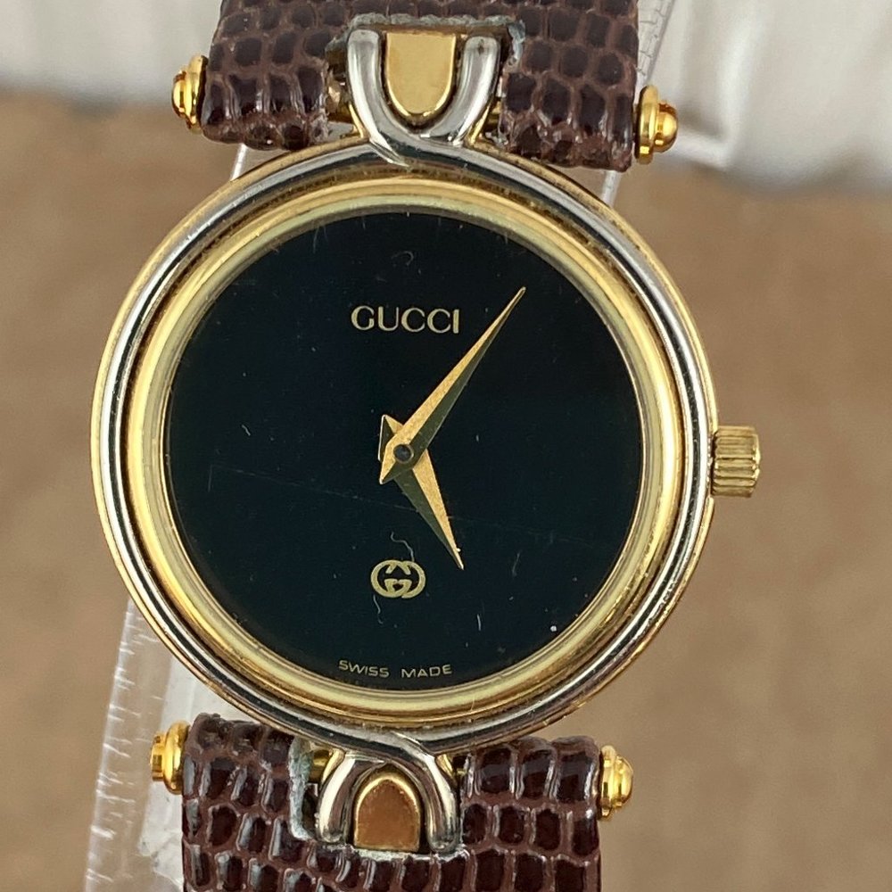 Vintage Gucci 4500L watch with Black Enamel face Gold sword hands Brown Strap